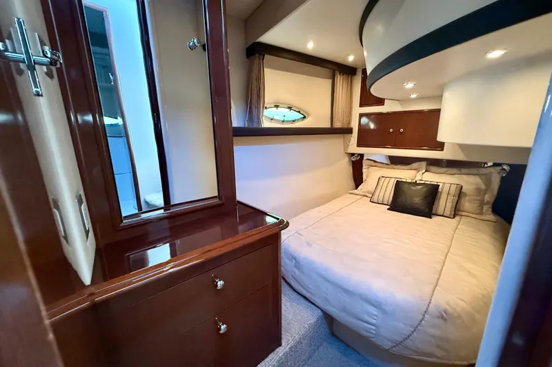  Yacht Photos Pics Luxurious cabin interior of 2009 Carver 43 Super Sport yacht with elegant wood finishes.