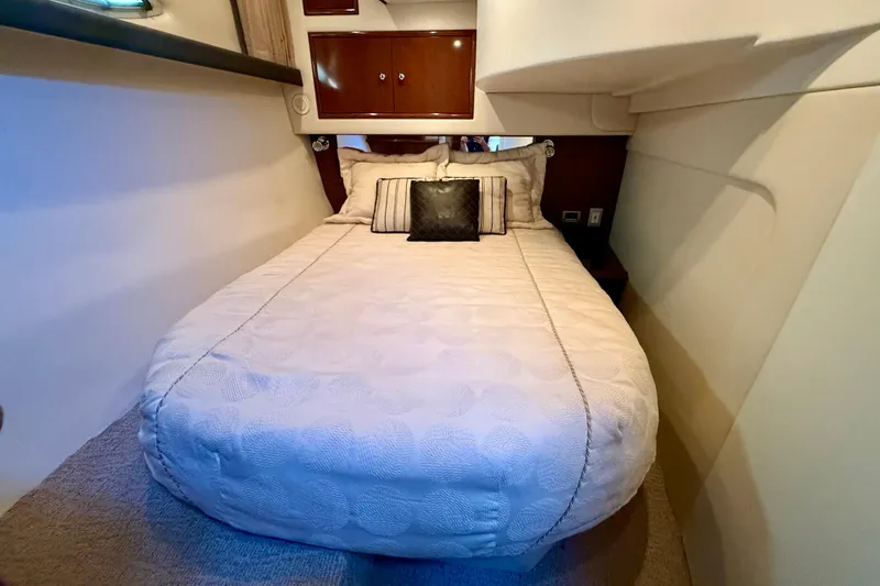  Yacht Photos Pics Luxurious bedroom interior of 2009 Carver 43 Super Sport yacht with cozy bedding.
