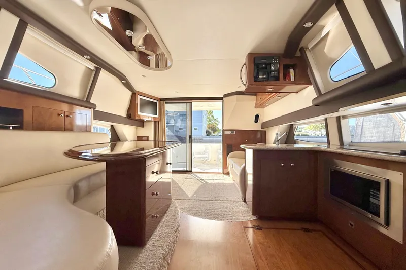  Yacht Photos Pics Luxurious interior of a 2009 Carver 43 Super Sport yacht with modern amenities.