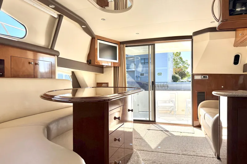  Yacht Photos Pics Luxurious interior of a 2009 Carver 43 Super Sport yacht with elegant wood finishes.