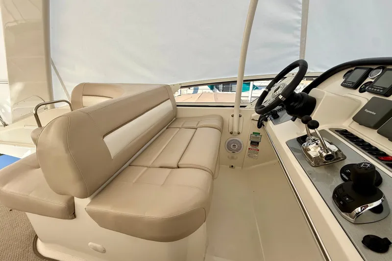  Yacht Photos Pics Interior of 2009 Carver 43 Super Sport yacht with beige seating and modern controls.