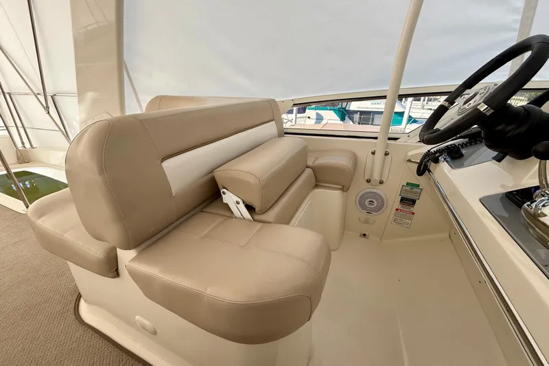  Yacht Photos Pics 2009 Carver 43 Super Sport helm with beige leather seating and steering wheel.