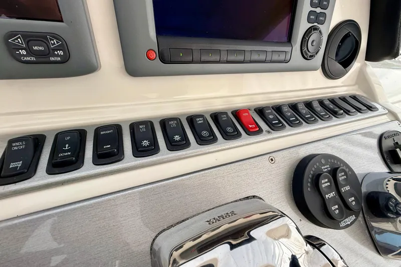  Yacht Photos Pics Control panel of a 2009 Carver 43 Super Sport yacht with various switches and dials.