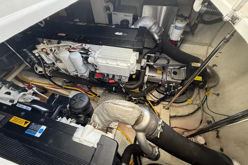  Yacht Photos Pics Engine room of a 2009 Carver 43 Super Sport yacht, showcasing mechanical components.