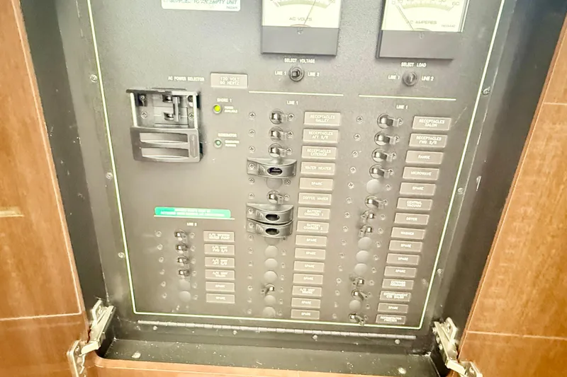  Yacht Photos Pics Electrical panel of a 2009 Carver 43 Super Sport boat, showing switches and meters.