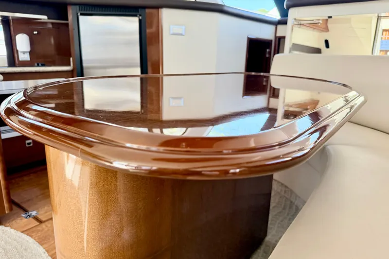  Yacht Photos Pics Luxurious interior of 2009 Carver 43 Super Sport yacht with polished wooden table.