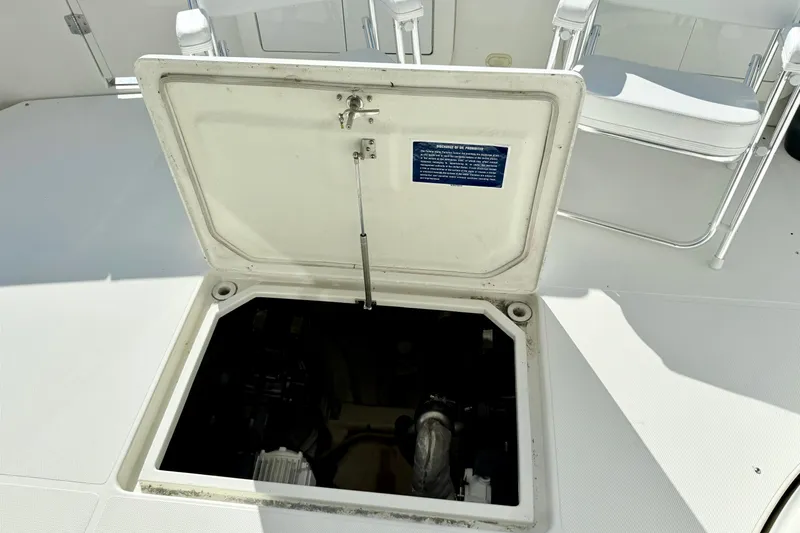  Yacht Photos Pics Open hatch on 2009 Carver 43 Super Sport boat deck, revealing interior compartment.