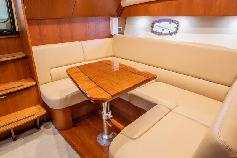 Teddy's Float Too Yacht Photos Pics Luxurious interior of 2015 Tiara Yachts 4300 Open with elegant wood and leather seating.