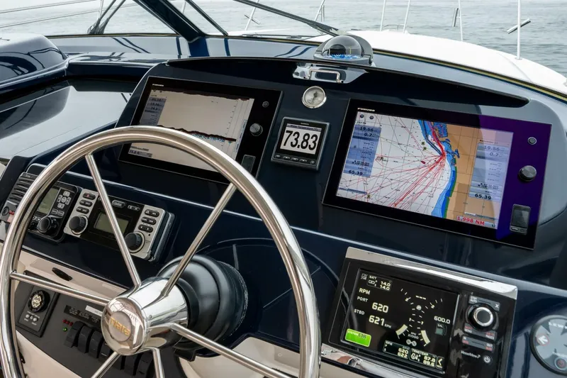 Teddy's Float Too Yacht Photos Pics Dashboard of 2015 Tiara Yachts 4300 Open with navigation and control systems.