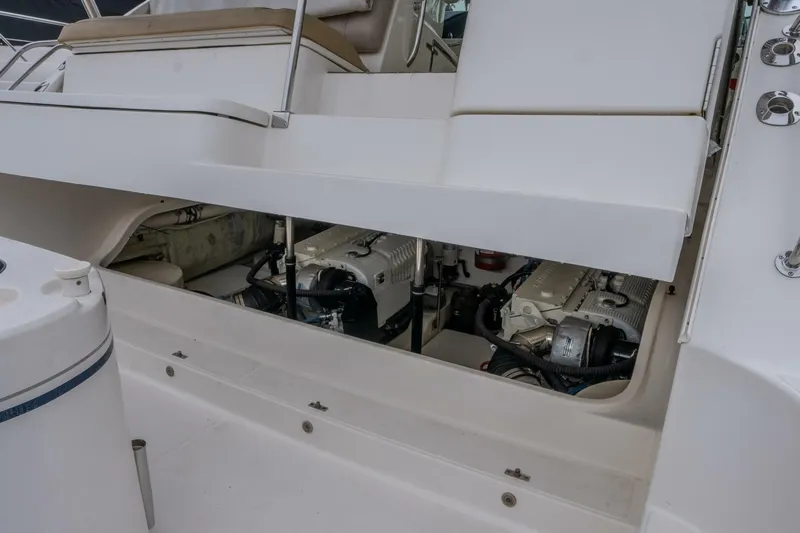 Teddy's Float Too Yacht Photos Pics Engine compartment of 2015 Tiara Yachts 4300 Open, showcasing dual engines and clean design.