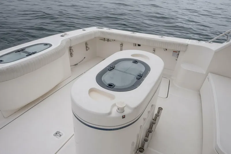 Teddy's Float Too Yacht Photos Pics 2015 Tiara Yachts 4300 Open boat deck with seating and storage compartments.