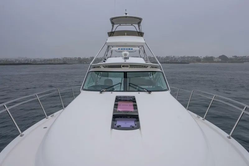 Teddy's Float Too Yacht Photos Pics 2015 Tiara Yachts 4300 Open on calm waters, overcast sky in background.