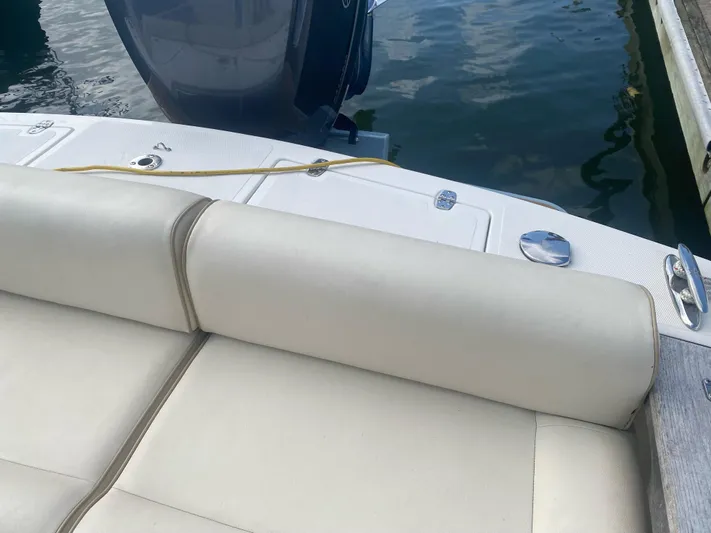  Yacht Photos Pics 2019 Hunt Yachts Harrier 26, rear seating and deck view at dock.