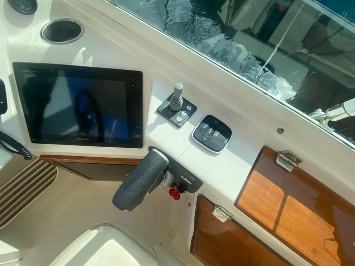  Yacht Photos Pics Control panel of 2019 Hunt Yachts Harrier 26 with navigation screen and joystick.