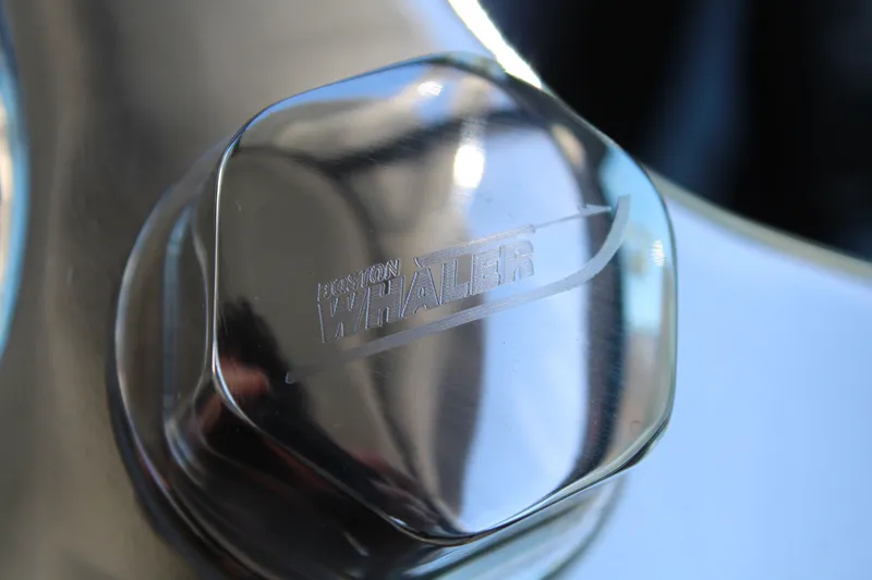 Going To The Sun Yacht Photos Pics Close-up of Boston Whaler 240 Vantage 2023 logo on metal.