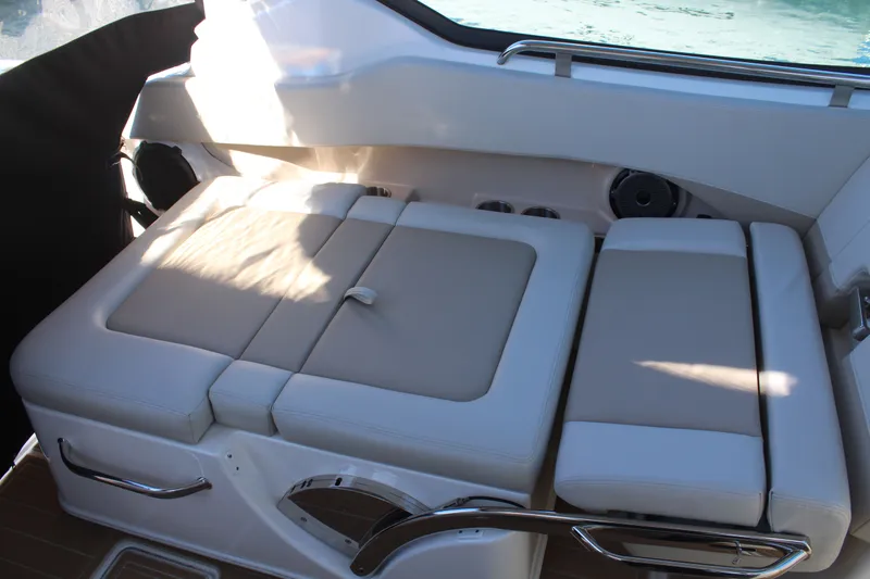 Going To The Sun Yacht Photos Pics Interior of 2023 Boston Whaler 240 Vantage with beige cushioned seating.