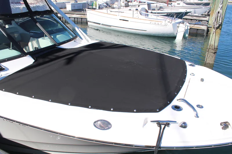 Going To The Sun Yacht Photos Pics 2023 Boston Whaler 240 Vantage with black cover at dock.
