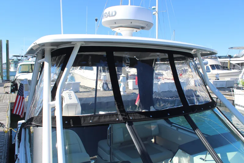 Going To The Sun Yacht Photos Pics Boston Whaler 240 Vantage 2023 at dock with clear sky.