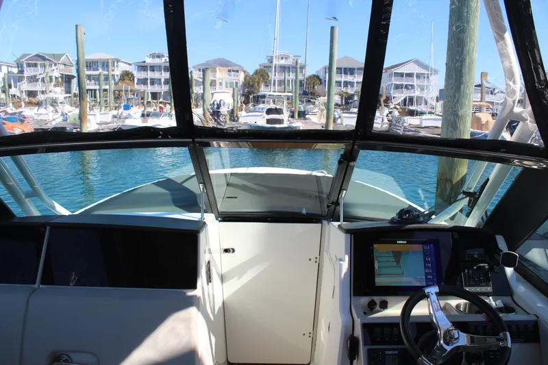 Going To The Sun Yacht Photos Pics Interior view of 2023 Boston Whaler 240 Vantage boat in harbor.