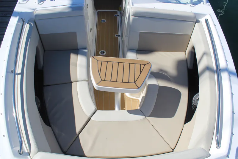 Going To The Sun Yacht Photos Pics Boston Whaler 240 Vantage 2023, luxurious seating area with table.