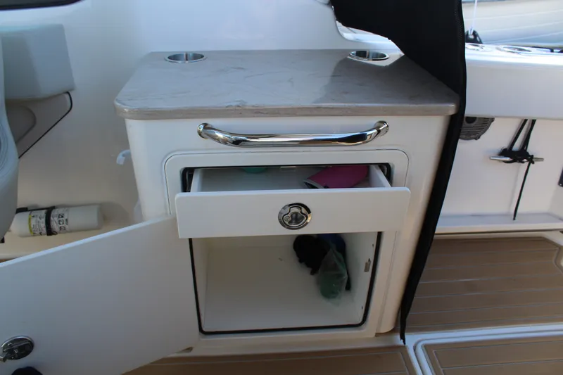 Going To The Sun Yacht Photos Pics Boston Whaler 240 Vantage 2023, open drawer and cabinet.