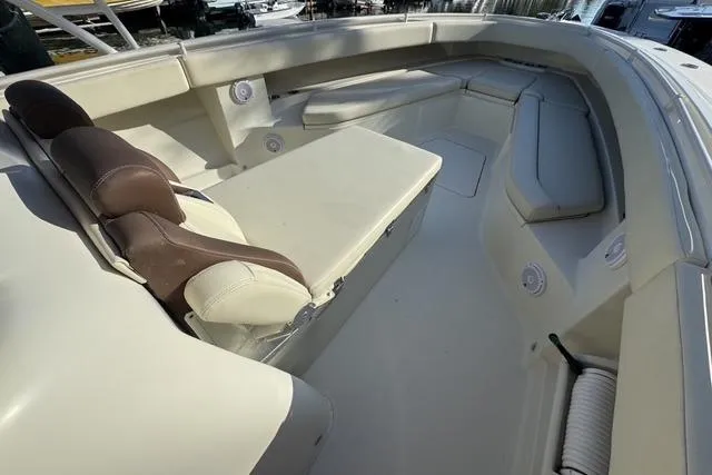  Yacht Photos Pics 2011 Hydra-Sports 4200 SF boat interior with cushioned seating and storage.