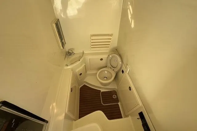  Yacht Photos Pics 2011 Hydra-Sports 4200 SF boat bathroom with sink, toilet, and wooden floor.