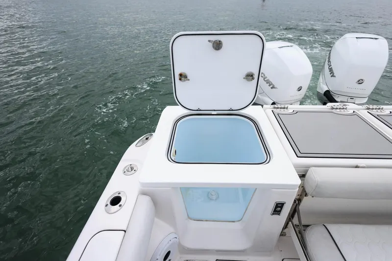  Yacht Photos Pics 2022 Sea Fox 368 Commander boat with open storage compartment and Mercury engines.