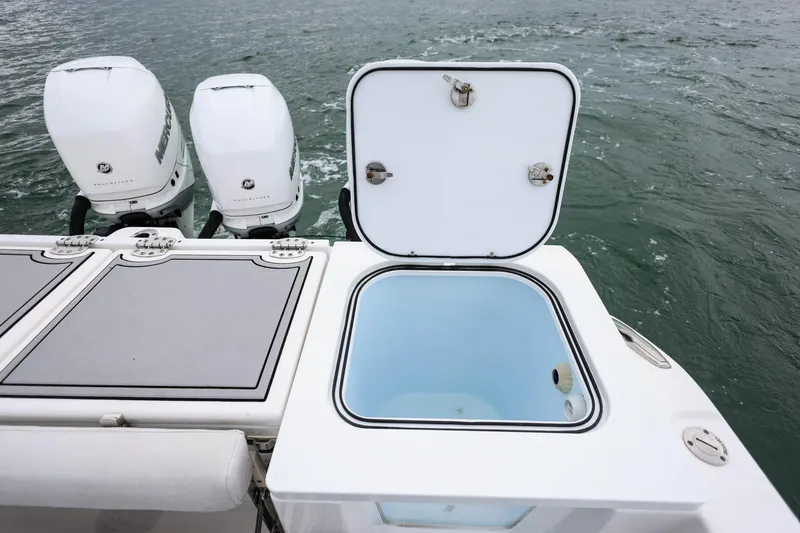  Yacht Photos Pics 2022 Sea Fox 368 Commander boat with open storage compartment and twin Mercury engines.