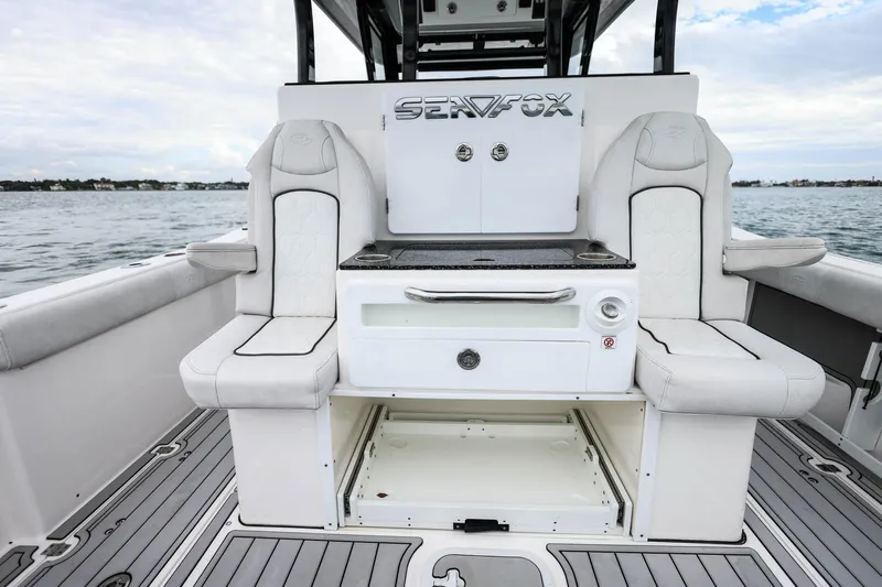  Yacht Photos Pics 2022 Sea Fox 368 Commander boat interior with seating and storage on the water.