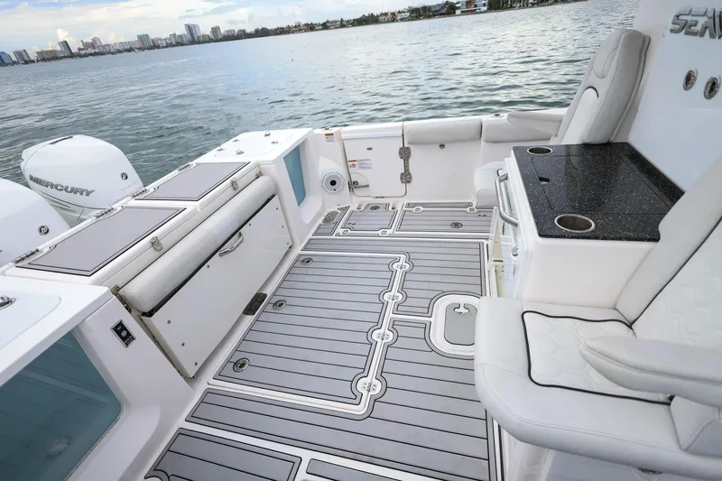  Yacht Photos Pics 2022 Sea Fox 368 Commander boat interior with seating, storage, and Mercury engines.