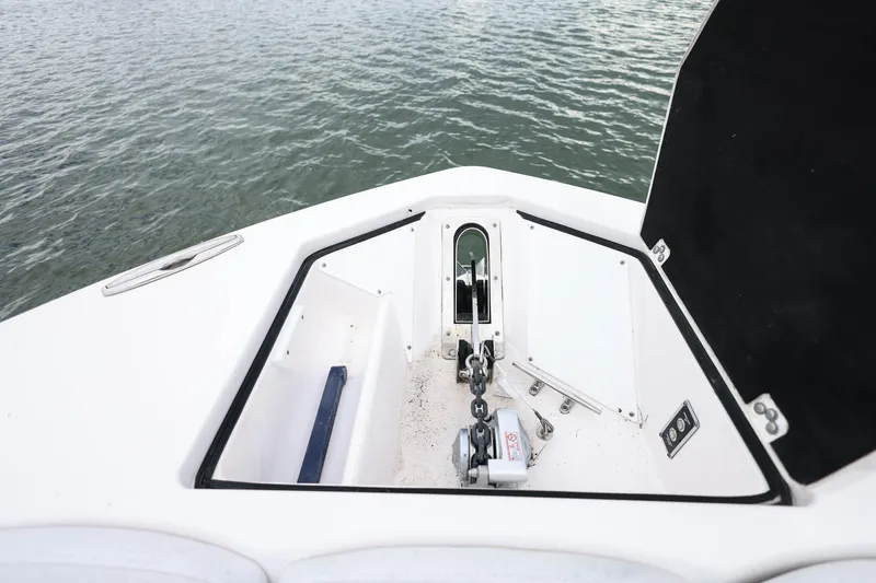  Yacht Photos Pics 2022 Sea Fox 368 Commander anchor compartment with chain and winch, on calm water.