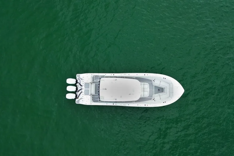  Yacht Photos Pics Aerial view of 2022 Sea Fox 368 Commander boat on green water.