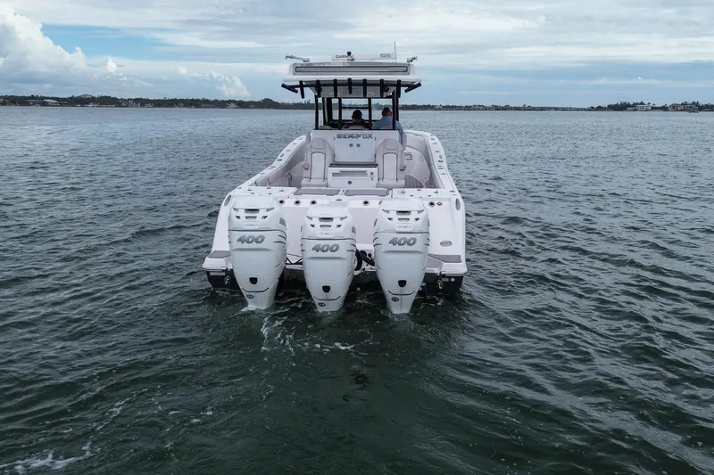  Yacht Photos Pics 2022 Sea Fox 368 Commander boat with triple 400 horsepower engines on open water.