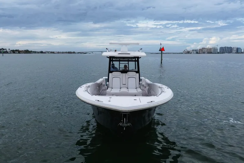  Yacht Photos Pics 2022 Sea Fox 368 Commander boat on calm water under cloudy sky.