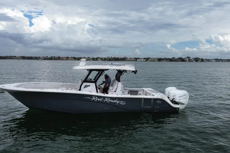  Yacht Photos Pics 2022 Sea Fox 368 Commander boat on calm water under cloudy sky.