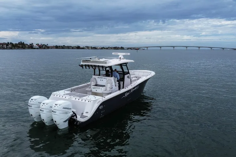  Yacht Photos Pics 2022 Sea Fox 368 Commander boat on calm water with bridge in background.