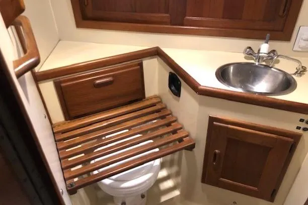 Sapphire Yacht Photos Pics 1992 Pacific Seacraft 37 yacht bathroom with wooden accents and compact sink.