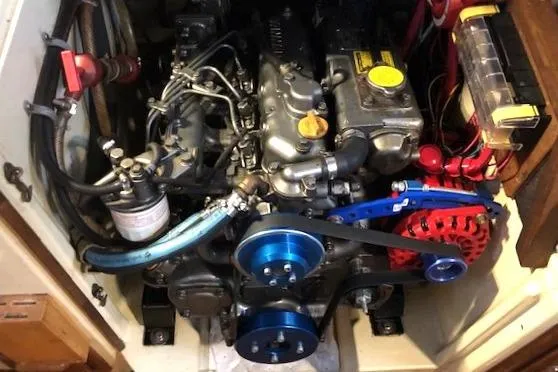 Sapphire Yacht Photos Pics Engine compartment of a 1992 Pacific Seacraft 37 sailboat, showcasing mechanical components.