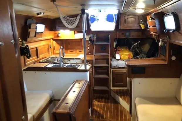 Sapphire Yacht Photos Pics Interior of 1992 Pacific Seacraft 37 sailboat with wooden cabinetry and cozy seating.