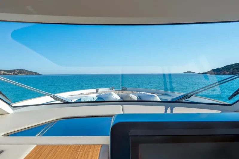  Yacht Photos Pics 2026 Solaris Power 52 Coupe yacht interior with ocean view through windshield.