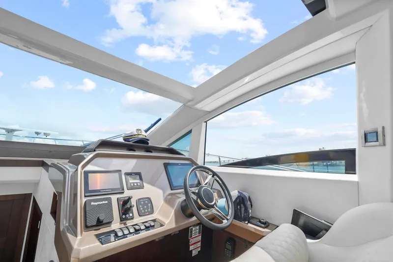 Good Vibes Yacht Photos Pics Interior helm of 2022 Galeon 470 Sky yacht with modern navigation equipment.