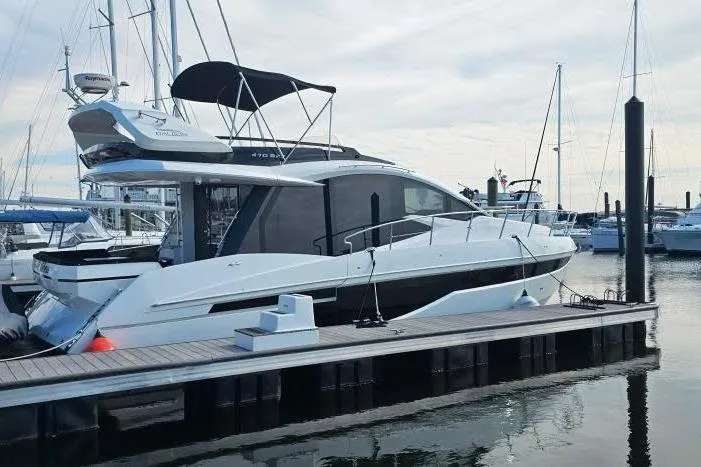 Good Vibes Yacht Photos Pics 2022 Galeon 470 Sky yacht docked at marina, sleek design, modern features.