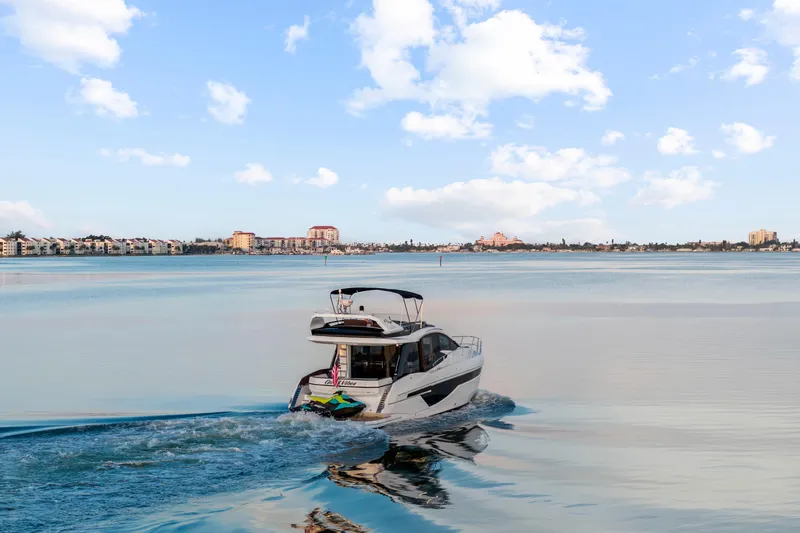 Good Vibes Yacht Photos Pics 2022 Galeon 470 Sky yacht cruising on calm waters under a clear blue sky.