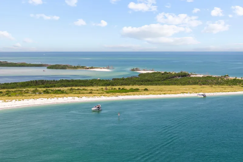 Good Vibes Yacht Photos Pics Aerial view of Galeon 470 Sky yacht near a scenic beach, 2022 model.
