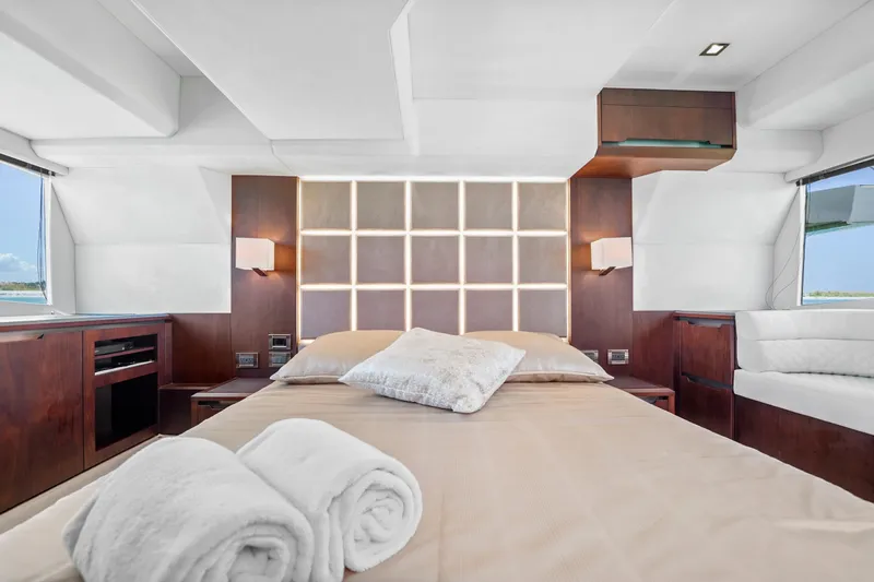 Good Vibes Yacht Photos Pics Luxurious bedroom interior of 2022 Galeon 470 Sky yacht with elegant wood finishes.
