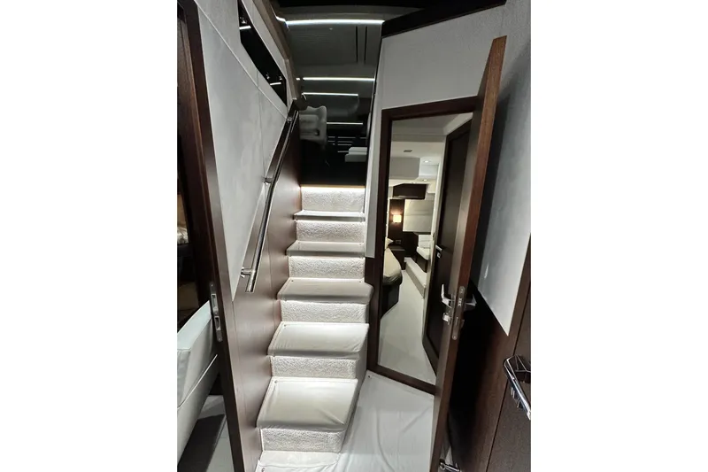 Good Vibes Yacht Photos Pics Interior staircase of 2022 Galeon 470 Sky yacht, featuring modern design and luxurious finishes.