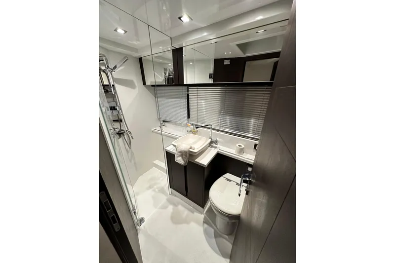 Good Vibes Yacht Photos Pics Luxurious bathroom in 2022 Galeon 470 Sky yacht with modern fixtures and sleek design.