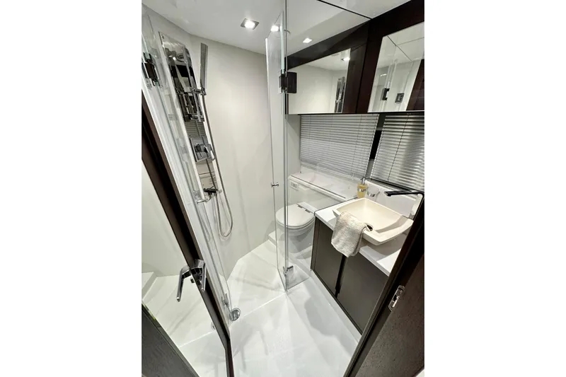 Good Vibes Yacht Photos Pics Luxurious bathroom in 2022 Galeon 470 Sky yacht with modern fixtures and sleek design.