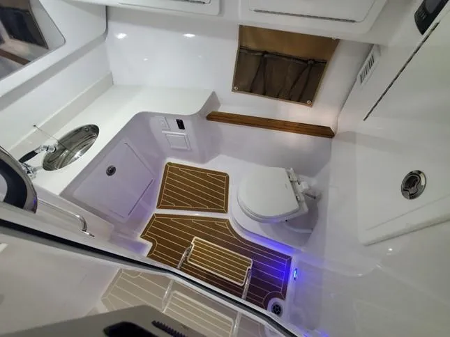 Nauti Nole Yacht Photos Pics Interior of 2021 Southport 33 DC with toilet and sink.